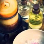 Image featuring a person enjoying the combined benefits of music therapy and aromatherapy for relaxation