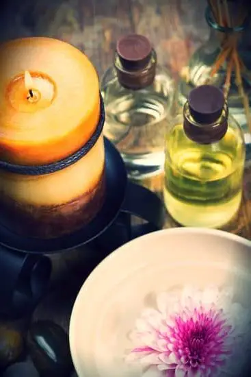 Combining Music Therapy and Aromatherapy 1 Image featuring a person enjoying the combined benefits of music therapy and aromatherapy for relaxation