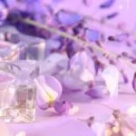 Aromatherapy, as defined by Milady, refers to the therapeutic use of essential oils for promoting physical and psychological well-being