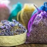 An assortment of natural essential oils and herbs used as Aromatherapy Ingredients for relaxation and healing