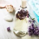 Aromatherapy massage towel on face, promoting relaxation and rejuvenation