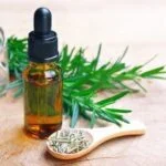 Does Aromatherapy Help Fibromyalgia Image of aromatherapy oils and a person with fibromyalgia, showing how does aromatherapy help fibromyalgia